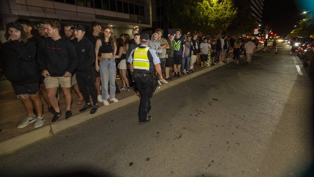 ACT Policing patrol Lonsdale Street on Saturday night during the Braddon Fringe Festival as part of Summernats. Picture by Gary Ramage
