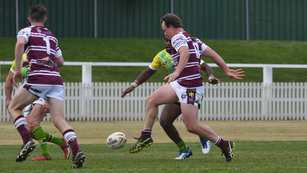 KICKING ON: Blayney under 18s coach Cameron Hobby puts a kick in during his side's premier league loss to CYMS on Sunday. Photos: CARLA FREEDMAN