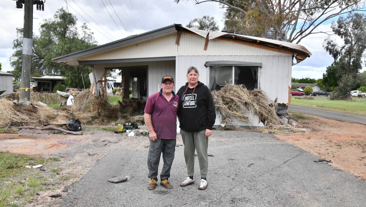 George and Sue Cross standing in front of house that floated down street to where it is and nearly hit them. Picture by Carla Freedman