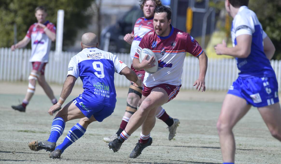 Joe Hobby tries to run through Pat's hooker Cameron Dennis during last year's finals series. Picture by Jude Keogh