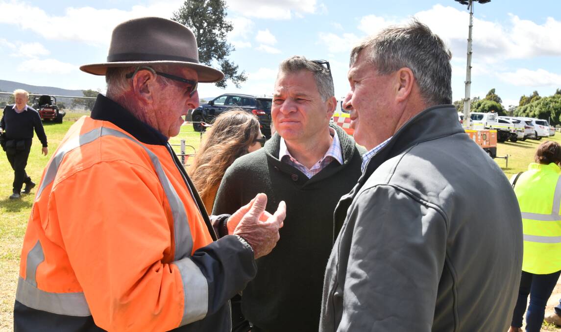Eugowra resident Tony Toohey talking to Member for Orange Phil Donato and Cabonne Mayor Kevin Beatty after the floods. Picture by Carla Freedman.