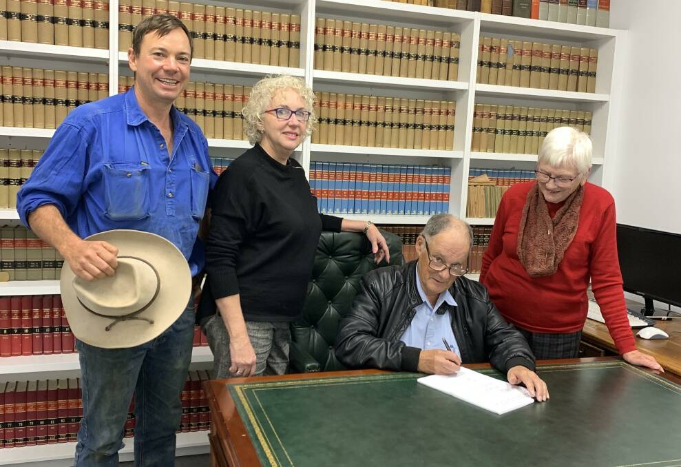 RUBBER-STAMPED: St Paul's Carcoar Community Facility Ltd directors George King, Ron Murray and Dawn Williams sign the contract on Friday, with Arden Law's Tricia Arden (second from left). Photo: CONTRIBUTED Tricia Arden of Arden Law Blayney, Ron Murray and Dawn Williams. 