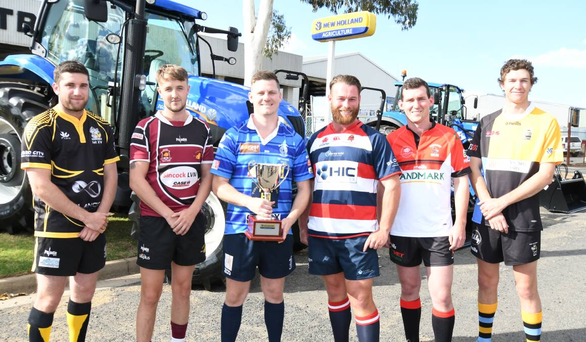 LAUNCHING PAD: Blayney captain Cam Cole (with trophy) and his New Holland Agriculture Cup counterparts, at Wednesday's launch. Photo: JUDE KEOGH