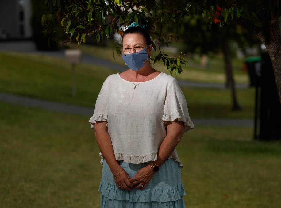 STRUGGLE: Meg Elliott outside her Gillieston Heights home on Friday. Picture: Max Mason-Hubers