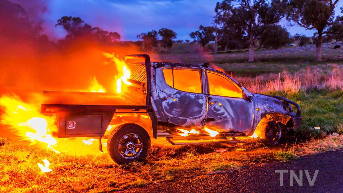 ABLAZE: A car which caught alight due to an engine malfunction on Thursday morning west of Orange. The car Photo: TROY PEARSON/Top Notch Video