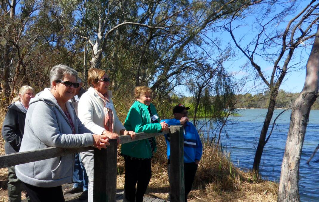 EXCITED: Probus Club members at the junction of the great Murray and Darling Rivers near Wentworth. Photo: SUPPLIED. 
