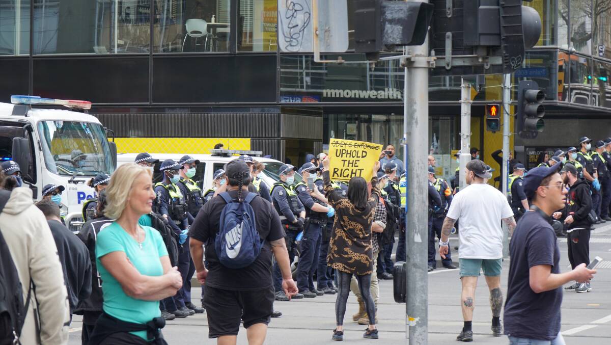 Police officers at an anti-lockdown protest during the COVID lockdown in the Melbourne CBD in August 2021. Picture: Shutterstock