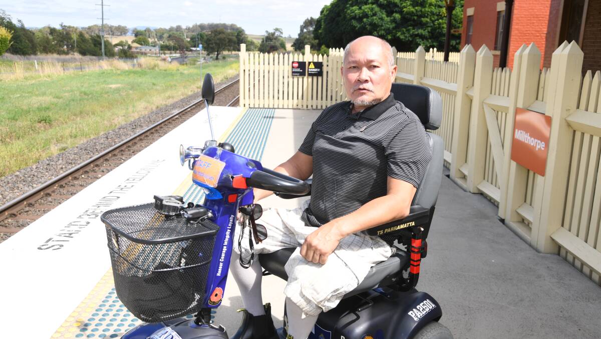 Van Nguyen at Millthorpe Station where he has been unable to board a train since the middle of November, 2023. Picture by Jude Keogh