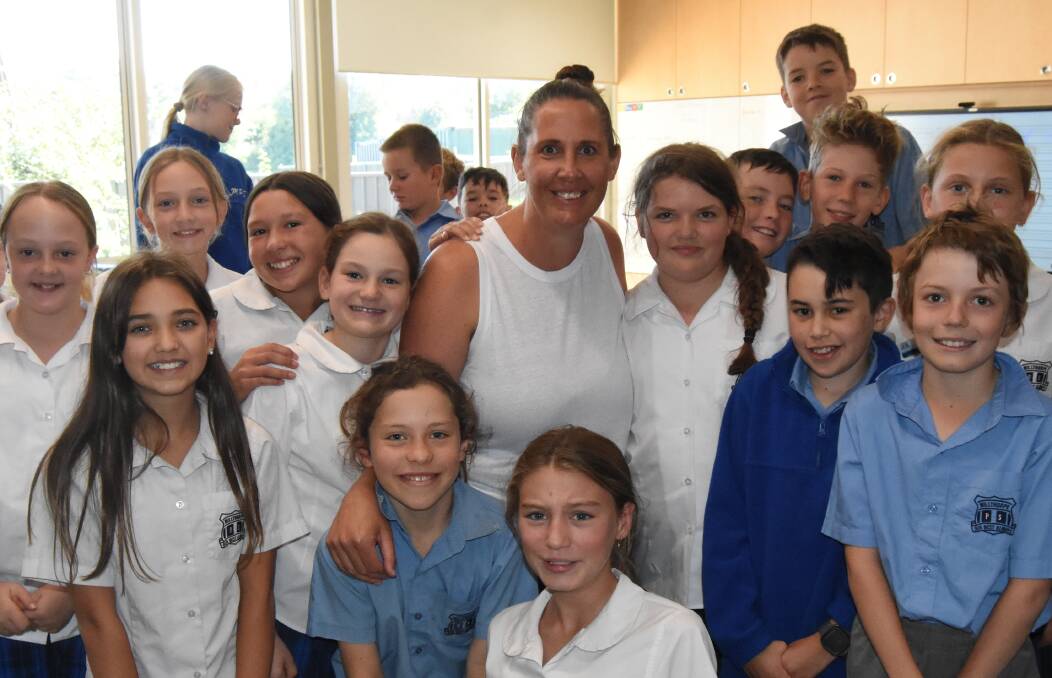 Jackie Payne surrounded by some of her year 5/6 class at Millthorpe Public School. Picture by Riley Krause