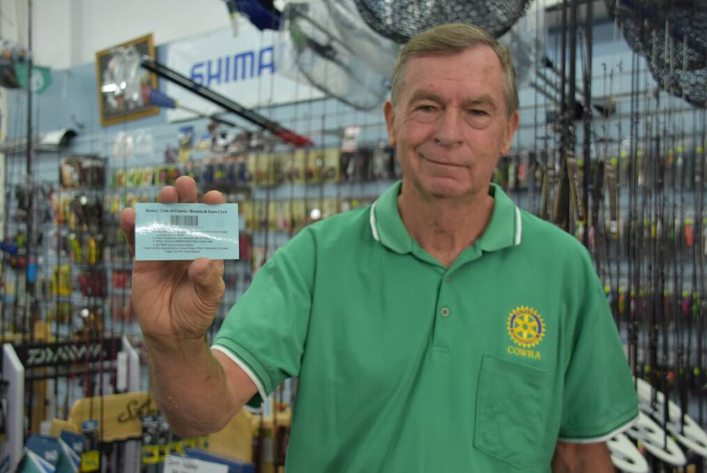 Cowra Rotary Club member Bob Griffiths with the Return and Earn cards at Compleat Angler and Camping World. 