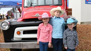 Enjoying the final day of AgQuip was Macy Kosub, 5, Pheasants Nest, with her brothers Broc, 8, and Cody, 2. 