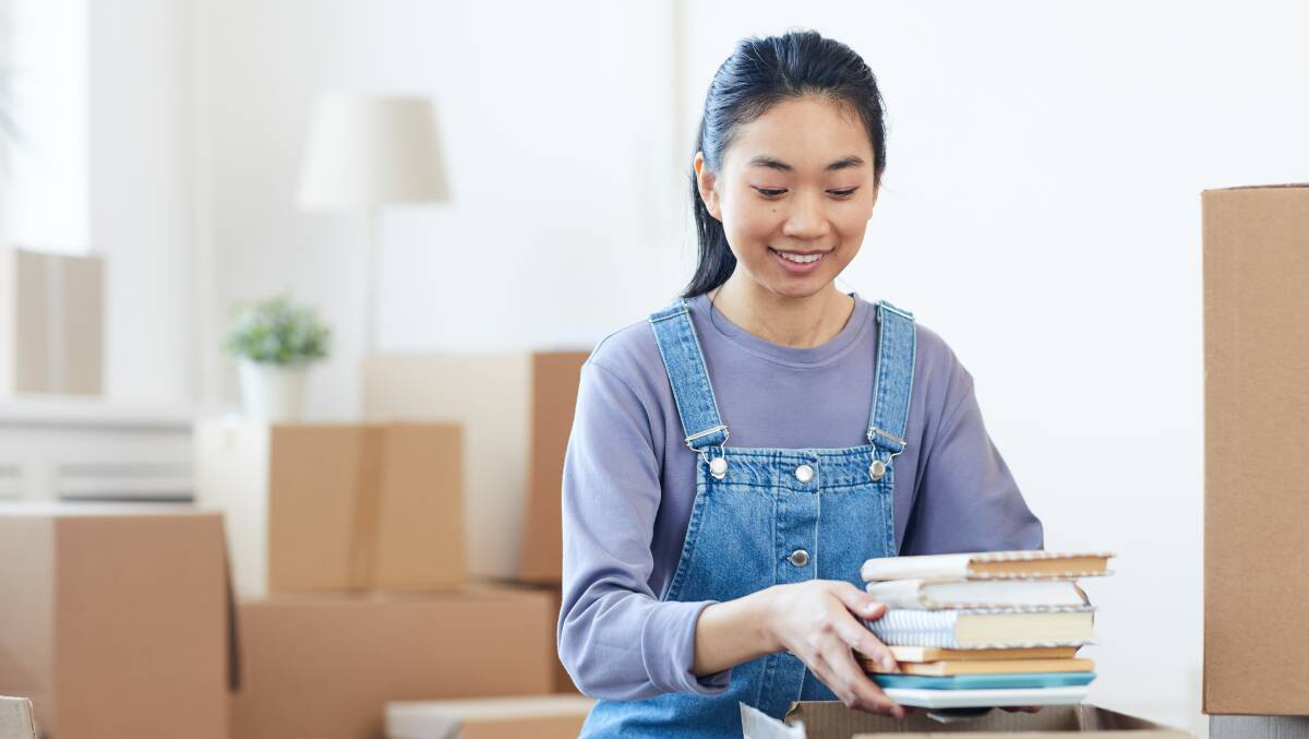 Pack by category, then room. Start with things you can live without first, like books and decor. Picture: Shutterstock.
