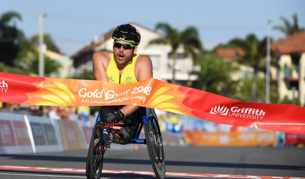 Victory: Kurt Fearnley after winning gold at the Gold Coast Commonwealth Games in April, 2018. He retired from international wheelchair racing after the games. 