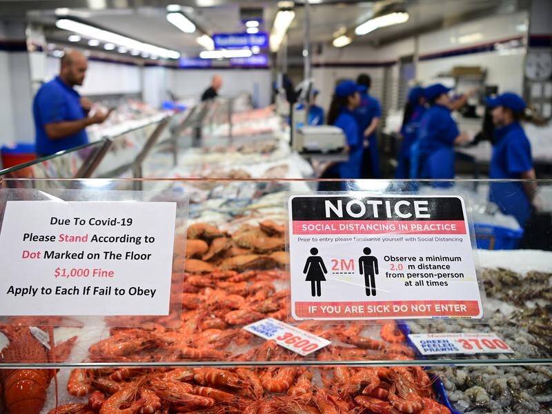 Strict social distancing measures are being enforced at the Sydney Fish Market this Easter.