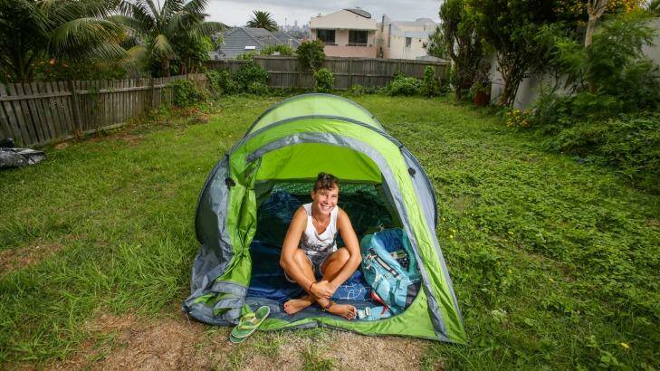 Backpacker Kimberley Boutard from Paris camping in the backyard of a Dover Heights home in Sydney on Saturday. Photo: Dallas Kilponen
