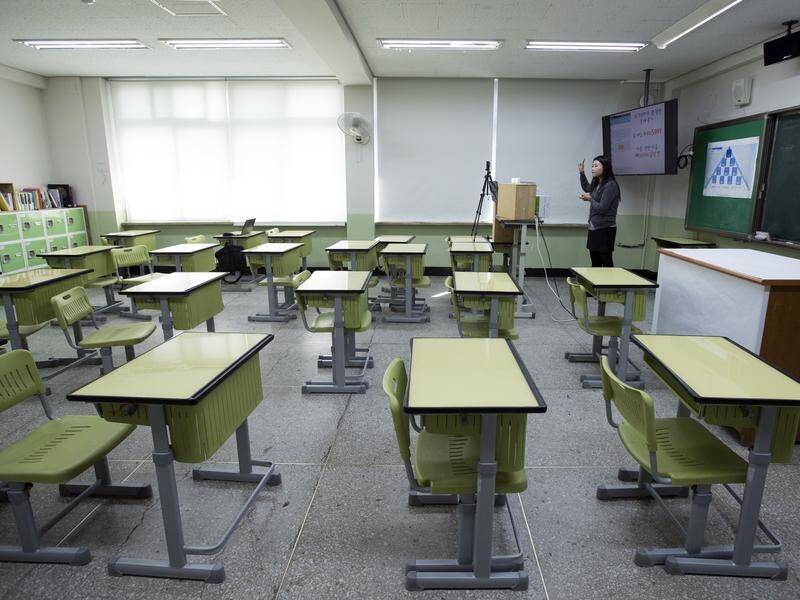South Korea's prime minister says the country isn't ready yet to open schools as before.