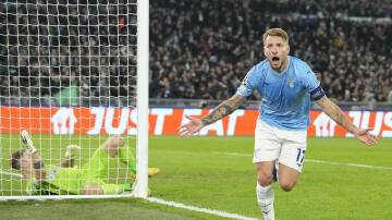 Lazio's Ciro Immobile celebrates after the first of his two goals in the 2-0 win against Celtic. (AP PHOTO)
