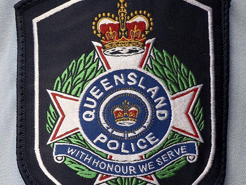 Police have charged a north Queensland mayor with assaulting two security guards.