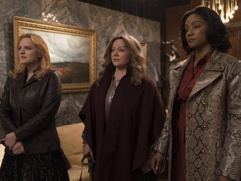 Elisabeth Moss (L), Melissa McCarthy (C) and Tiffany Haddish play mobster wives in The Kitchen.