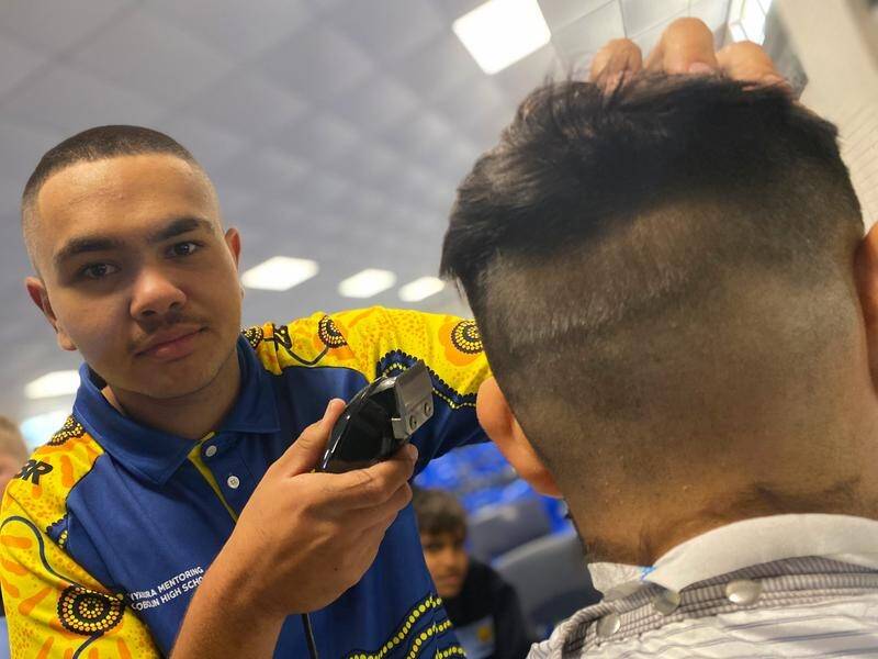 Students from a school in Sydney's west have been teaching barbershop skills at a country school. (PR HANDOUT IMAGE PHOTO)