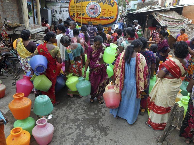 Millions of people are turning to water tank trucks in India as house and hotel taps run dry.