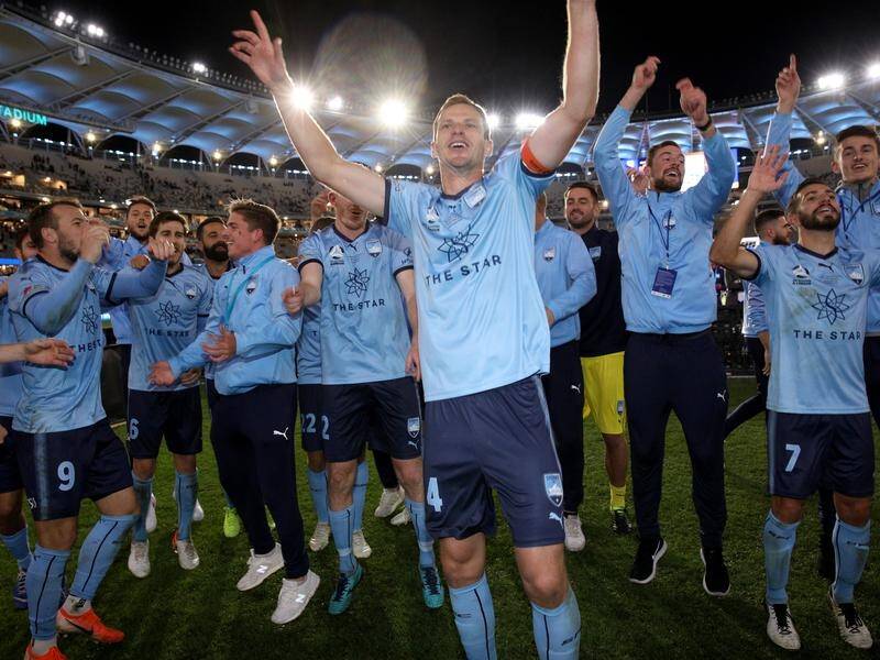 Sydney FC celebrate winning the A-League grand final with a penalty shootout victory over Perth.