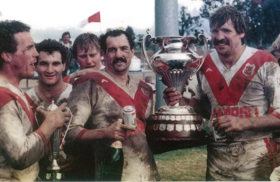 HAPPY DAYS: Mudgee Dragons players Peter Potts, Scott Meini, Bruce Honeysett, Ron Hilditch and Phil Mann celebrating their 1986 Group 10 premiership.