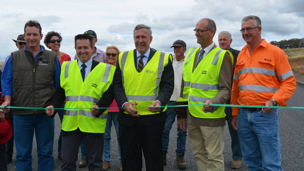 AHEAD OF SCHEDULE: CTLX manager Nathan Morris, Paul Toole MP, NSW Minister for Roads and Freight Duncan Gay, Blayney Shire Council mayor Scott Ferguson and Cadia Valley Operations general manager Tony McPaul inspected the upgrades on Errowanbang Road. 0201ederrowanbang