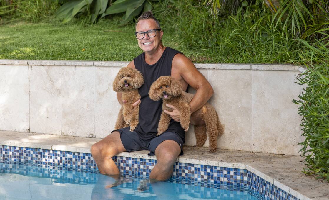 Tim Bailey, with his beloved poodles Motu and Surfie, is on top of the world since. Photo: Dallas Kilponen