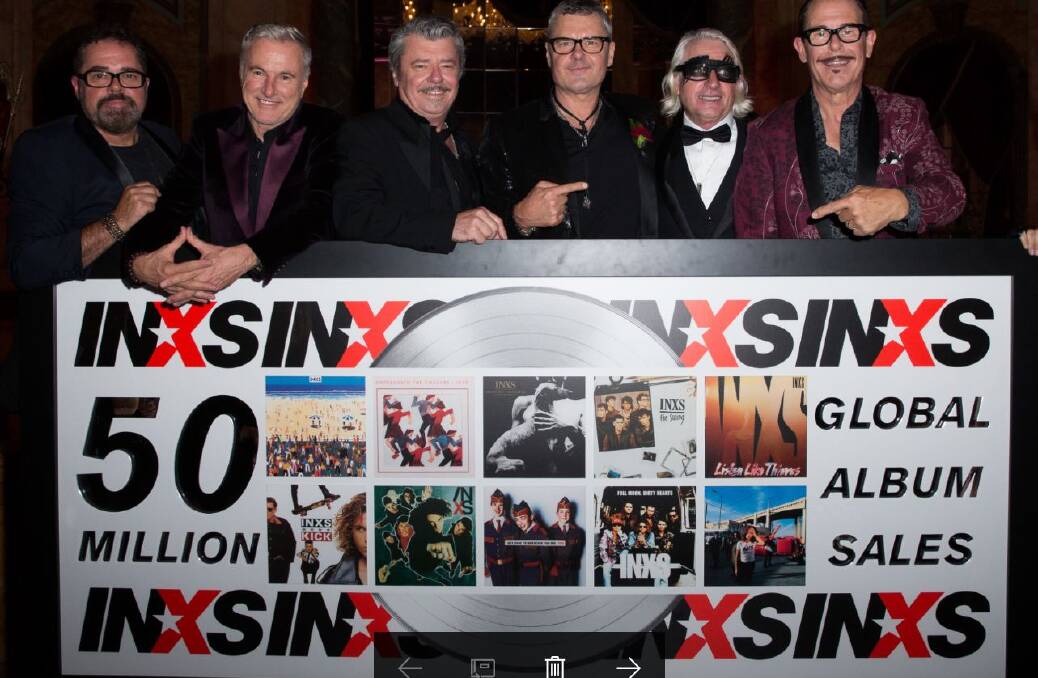 INXS' last photo with their manager Chris Murphy (second from right). Photo: Supplied