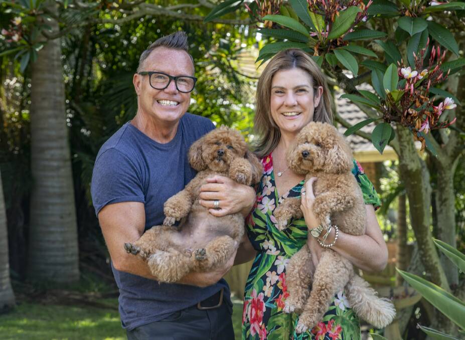 FAMILY: Tim and Sam Bailey with their beloved poodles Surfie and Motu. Picture and cover image: Dallas Kilponen