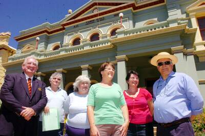 DAYS GONE BY: Mayor John Davis, councillor Chris Gryllis (right) and Orange Historical Society members Elizabeth Griffin, Sue Milne, Liz Edwards and Julie Skyes are looking forward to celebrating 150 years of local government in Orange.