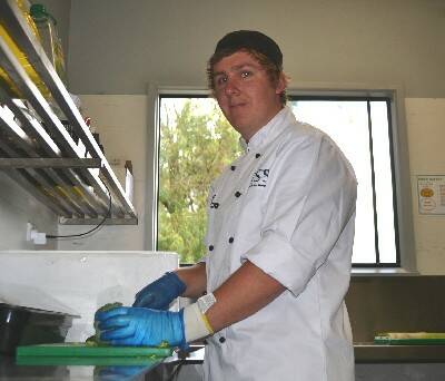 NEW APPRENTICE: Millthorpe's Alex Collins at work on his first day as an apprentice chef