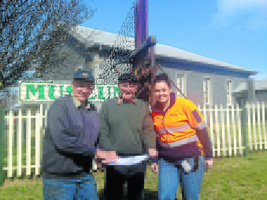 Millthorpe museum's vice presidents Peter Whiley, Peter Amos with Cadia Valley Operations' Melissa Schumacher looking at plans for the new shed at the Museum.