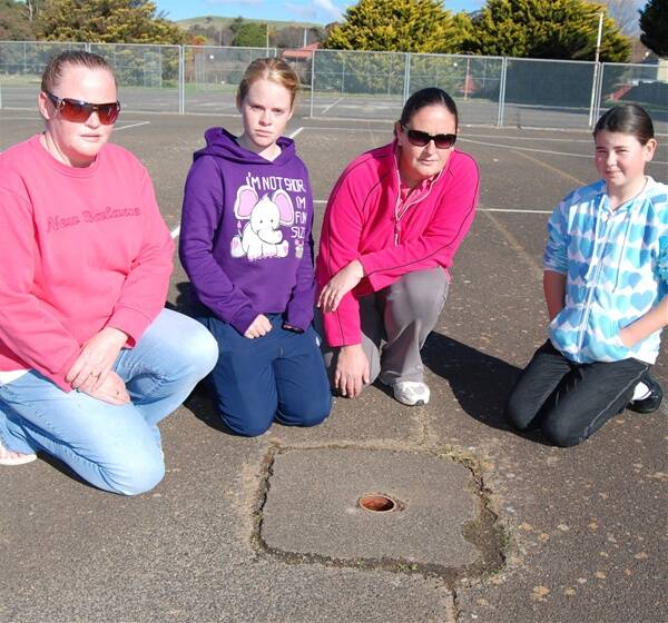 The Blayney District Netball Association is tired of waiting for maintenance work at the court complex. Pictured is president Jacque Cockburn, netball player Ashleigh Cockburn, secretary Teressa Coughlan and netball player Emily Szabo near one of the courts’ many trip hazards.