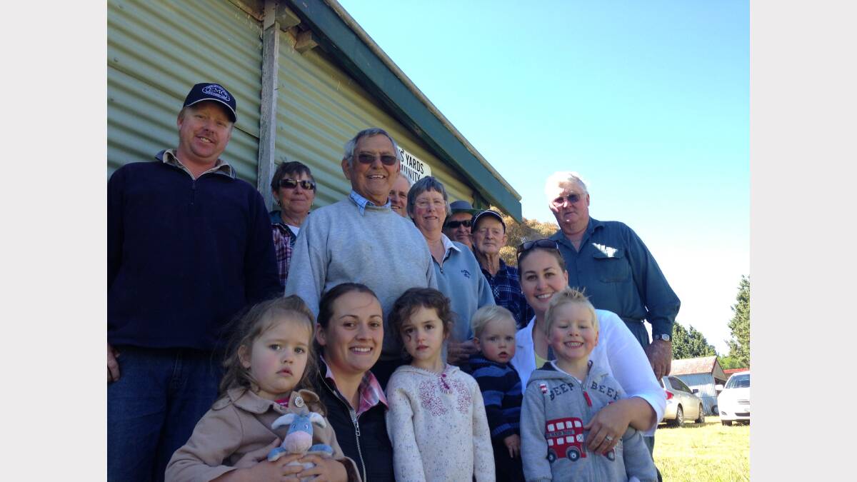 Hobbys Yards locals in front of their hamlet's hall: front row from left Amara Ryan, Jasmine Ryan, Elena, Lachlan Ryan, Sally Ryan (behind), and William Ryan. Back row from left Steve Ryan, Margaret Glasby, Donald Young, Tony Goodacre (obscured), Kevin Dwyer, Frank Dwyer and Max Ryan. Photo: Margaret Paton