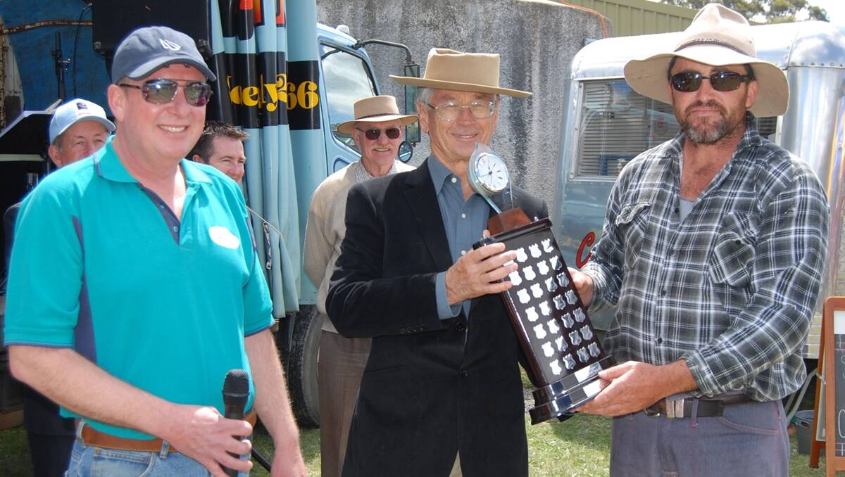 Dick Smith along with John Baker (left) present Champion local fleece winner, Glen Byrnes with his trophy.  