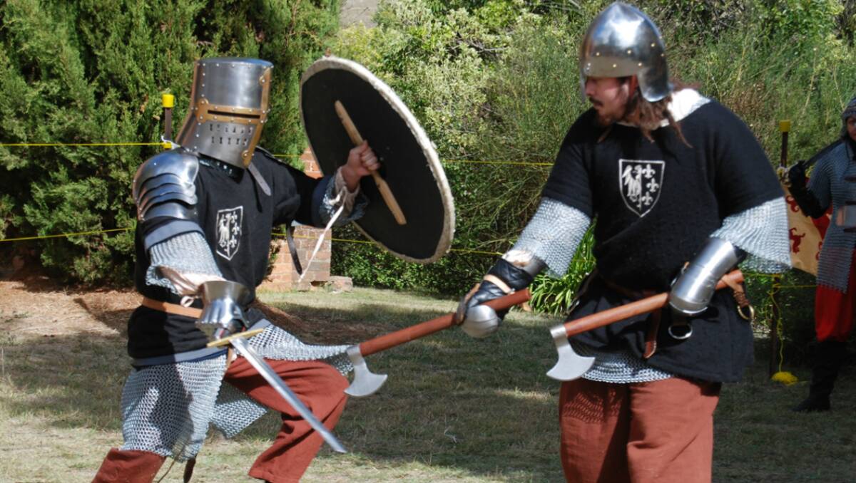  Knights of the realm battle it out at the medieval display at St. Paul’s fair on Saturday.  Photo: Wayne Cock.